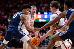 Nebraska Cornhusker forward Rienk Mast (51) makes a pass to forward Braden Frager (5) against Creighton Bluejay forward Jasen Green (0) in the first half during a college basketball game on Sunday, Dec. 7, 2025, in Lincoln, Nebraska. Photo by John S. Peterson.