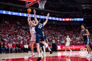Nebraska Cornhusker forward Rienk Mast (51) puts up a lay up against Creighton Bluejay forward Kerem Konan (17) in the first half during a college basketball game on Sunday, Dec. 7, 2025, in Lincoln, Nebraska. Photo by John S. Peterson.