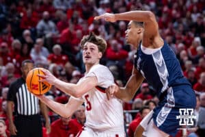 Nebraska Cornhusker forward Braden Frager (5) drives to the basket against Creighton Bluejay forward Jasen Green (0) in the first half during a college basketball game on Sunday, Dec. 7, 2025, in Lincoln, Nebraska. Photo by John S. Peterson.