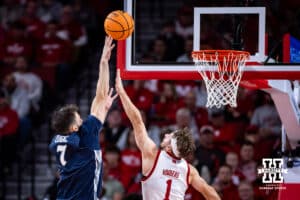Creighton Bluejay guard Fedor Žugić (7) takes a shot over Nebraska Cornhusker guard Sam Hoiberg (1) in the first half during a college basketball game on Sunday, Dec. 7, 2025, in Lincoln, Nebraska. Photo by John S. Peterson.