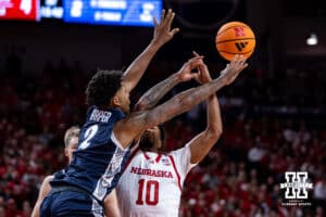 Nebraska Cornhusker guard Jamarques Lawrence (10) loses the ball against Creighton Bluejay guard Blake Harper (2) in the first half during a college basketball game on Sunday, Dec. 7, 2025, in Lincoln, Nebraska. Photo by John S. Peterson.