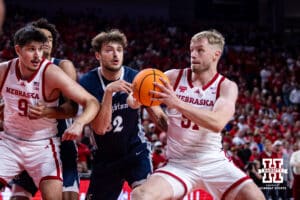 Nebraska Cornhusker forward Rienk Mast (51) drives to the basket against Creighton Bluejay forward Owen Freeman (32) in the first half during a college basketball game on Sunday, Dec. 7, 2025, in Lincoln, Nebraska. Photo by John S. Peterson.