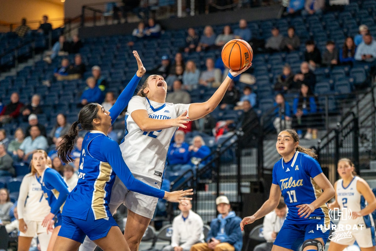 Creighton Bluejay Grace Boffeli (42) gets fouled during a layup during a basketball game against Tulsa on Sunday, Dec 7, 2025, in Omaha, Nebraska. Photo by Brandon Tiedemann.