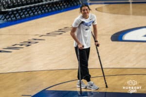 Creighton Bluejay Kiani Lockett (11) smiles at teammates before a basketball game against Tulsa on Sunday, Dec 7, 2025, in Omaha, Nebraska. Photo by Brandon Tiedemann.
