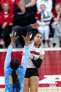 Nebraska Cornhusker outside hitter Teraya Sigler (11) spikes the ball against LIU Shark middle blocker Yasmeen Muhammad (15) in the third set during the first round of the NCAA volleyball tournament on Friday, Dec. 5, 2025, in Lincoln, Nebraska. Photo by John S. Peterson.