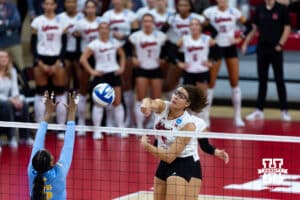 Nebraska Cornhusker middle blocker Rebekah Allick (5) spikes the ball against LIU Shark middle blocker Yasmeen Muhammad (15) during the first round of the NCAA volleyball tournament on Friday, Dec. 5, 2025, in Lincoln, Nebraska. Photo by John S. Peterson.
