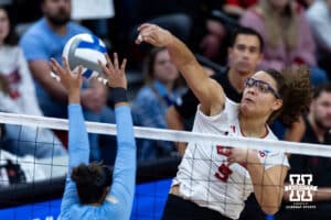 Nebraska Cornhusker middle blocker Rebekah Allick (5) spikes the ball against LIU Shark outside hitter Mia Rojas-Avila (3) in the second set during the first round of the NCAA volleyball tournament on Friday, Dec. 5, 2025, in Lincoln, Nebraska. Photo by John S. Peterson.