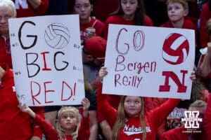 Nebraska Cornhusker fans holding up signs during the first round of the NCAA volleyball tournament against the LIU Sharks on Friday, Dec. 5, 2025, in Lincoln, Nebraska. Photo by John S. Peterson.