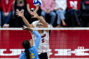 Nebraska Cornhusker middle blocker Rebekah Allick (5) blocks the ball against LIU Shark middle blocker Yasmeen Muhammad (15) during the first round of the NCAA volleyball tournament on Friday, Dec. 5, 2025, in Lincoln, Nebraska. Photo by John S. Peterson.