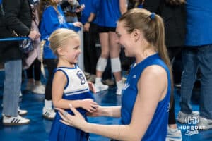 Creighton Bluejay Kiara Reinhardt (5) hugs a young fan after a volleyball match game against Northern Iowa on Thursday, Dec 5, 2025, in Omaha, Nebraska. Photo by Brandon Tiedemann.