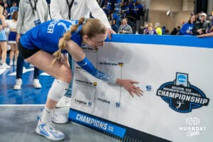 Creighton Bluejay Annalea Maeder (17) puts the sticker on the board after a volleyball match game against Northern Iowa on Thursday, Dec 5, 2025, in Omaha, Nebraska. Photo by Brandon Tiedemann.