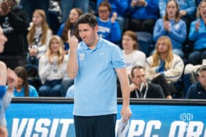 Creighton Bluejay head coach Brian Rosen smirks after a timeout during a volleyball match game against Northern Iowa on Thursday, Dec 5, 2025, in Omaha, Nebraska. Photo by Brandon Tiedemann.