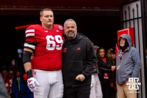 ebraska Cornhusker offensive lineman Turner Corcoran (69) poses for a photo with head coach Matt Rhule for senior day before a college football game against the Iowa Hawkeyes on Friday, Nov. 28, 2025, in Lincoln, Nebraska. Photo by John S. Peterson.