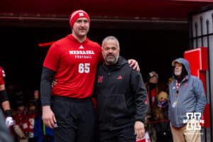 Nebraska Cornhusker offensive lineman Teddy Prochazka (65) poses for a photo with head coach Matt Rhule for senior day before a college football game against the Iowa Hawkeyes on Friday, Nov. 28, 2025, in Lincoln, Nebraska. Photo by John S. Peterson.