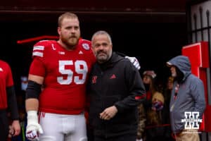 Nebraska Cornhusker offensive lineman Henry Lutovsky (59) poses for a photo with head coach Matt Rhule for senior day before a college football game against the Iowa Hawkeyes on Friday, Nov. 28, 2025, in Lincoln, Nebraska. Photo by John S. Peterson.