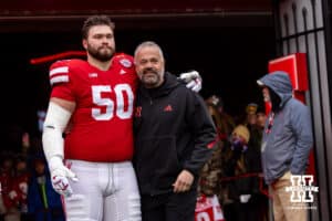 Nebraska Cornhusker offensive lineman Rocco Spindler (50) poses for a photo with head coach Matt Rhule for senior day before a college football game against the Iowa Hawkeyes on Friday, Nov. 28, 2025, in Lincoln, Nebraska. Photo by John S. Peterson.