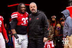 Nebraska Cornhusker linebacker Marques Watson-Trent (33) poses for a photo with head coach Matt Rhule for senior day before a college football game against the Iowa Hawkeyes on Friday, Nov. 28, 2025, in Lincoln, Nebraska. Photo by John S. Peterson.