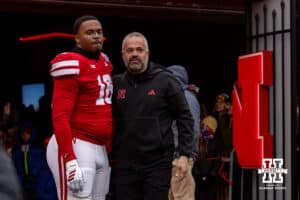 Nebraska Cornhusker defensive lineman Elijah Jeudy (16) poses for a photo with head coach Matt Rhule for senior day before a college football game against the Iowa Hawkeyes on Friday, Nov. 28, 2025, in Lincoln, Nebraska. Photo by John S. Peterson.