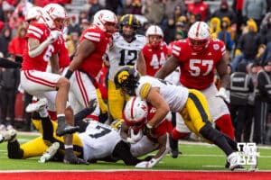Nebraska Cornhusker running back Emmett Johnson (21) is stop short of the goal line byIowa Hawkeye linebacker Jaden Harrell (41) at the end of the fourth quarter during a college football game on Friday, Nov. 28, 2025, in Lincoln, Nebraska. Photo by John S. Peterson.
