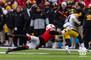 Nebraska Cornhusker defensive back Ceyair Wright (1) grabs Iowa Hawkeye wide receiver Kaden Wetjen (21) to make the stop during a college football game on Friday, Nov. 28, 2025, in Lincoln, Nebraska. Photo by John S. Peterson.