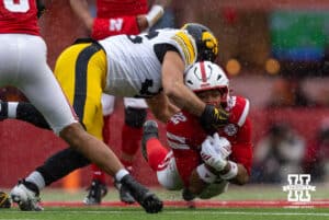 Nebraska Cornhusker running back Isaiah Mozee (22) dives for the extra yard against Iowa Hawkeye linebacker Jayden Montgomery (36) during a college football game on Friday, Nov. 28, 2025, in Lincoln, Nebraska. Photo by John S. Peterson.