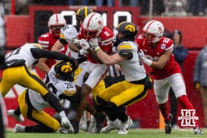 Nebraska Cornhusker wide receiver Jacory Barney Jr. (2) is tackled by Iowa Hawkeyes during a college football game on Friday, Nov. 28, 2025, in Lincoln, Nebraska. Photo by John S. Peterson.