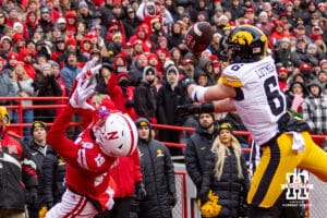 Iowa Hawkeye defensive back Zach Lutmer (6) breaks up a pass to Nebraska Cornhusker wide receiver Cortez Mills Jr. (19) during a college football game on Friday, Nov. 28, 2025, in Lincoln, Nebraska. Photo by John S. Peterson.
