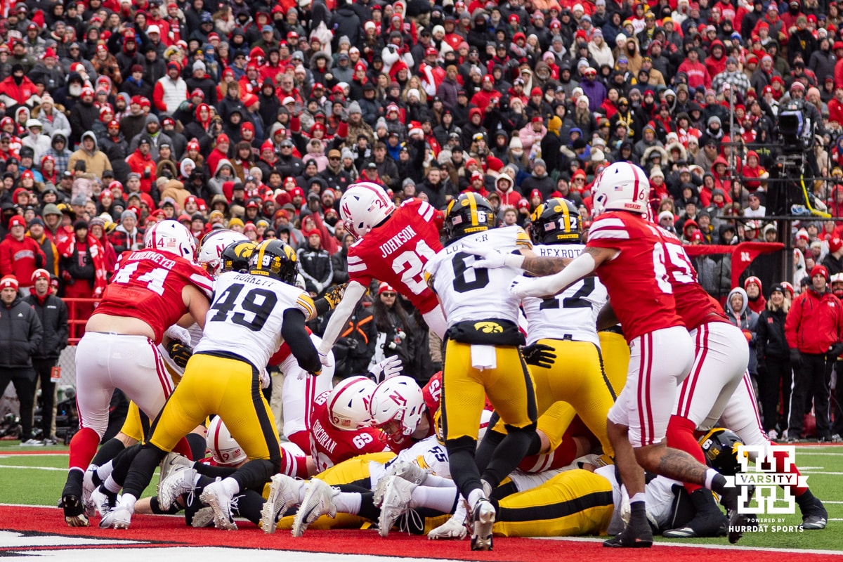 Nebraska Cornhusker running back Emmett Johnson (21) dives for a touchdown against the Iowa Hawkeyes in the first quarter during a college football game on Friday, Nov. 28, 2025, in Lincoln, Nebraska. Photo by John S. Peterson.