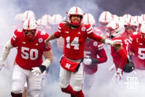Nebraska Cornhusker quarterback TJ Lateef (14) leads the Huskers out of the tunnel to take on the Iowa Hawkeyes during a college football game on Friday, Nov. 28, 2025, in Lincoln, Nebraska. Photo by John S. Peterson.