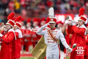 Nebraska Cornhusker Marching Band drum major salutes during the National Anthem during a college football game on Friday, Nov. 28, 2025, in Lincoln, Nebraska. Photo by John S. Peterson.