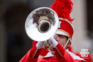 Nebraska Cornhusker Marching Band member plays a solo during warm-ups for a college football game against the Iowa Hawkeyes on Friday, Nov. 28, 2025, in Lincoln, Nebraska. Photo by John S. Peterson.