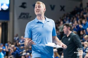 Creighton Bluejay assistant coach Adam Kessenich smiles during a volleyball match game against Northern Colorado on Thursday, Dec 4, 2025, in Omaha, Nebraska. Photo by Brandon Tiedemann.