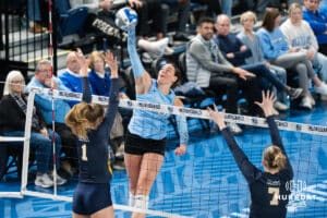 Creighton Bluejay Eloise Brandewie (10) hits the ball over a defender during a volleyball match game against Northern Colorado on Thursday, Dec 4, 2025, in Omaha, Nebraska. Photo by Brandon Tiedemann.