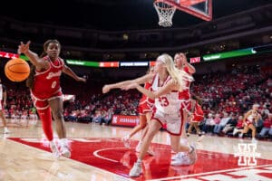 Nebraska Cornhusker guard Britt Prince (23) makes a pass around Bradley Brave guard Kaylen Nelson (0) in the second half during a college basketball game on Wednesday, Dec. 3, 2025, in Lincoln, Nebraska. Photo by John S. Peterson.