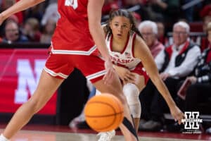 Nebraska Cornhusker guard Kennadi Williams (15) makes a pass around Bradley Brave guard Mya Wardle (10) in the second half during a college basketball game on Wednesday, Dec. 3, 2025, in Lincoln, Nebraska. Photo by John S. Peterson.