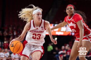 Nebraska Cornhusker guard Britt Prince (23) drives to the basket against Bradley Brave forward Kali Fortson (21) in the second half during a college basketball game on Wednesday, Dec. 3, 2025, in Lincoln, Nebraska. Photo by John S. Peterson.