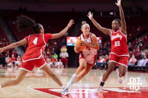 Nebraska Cornhusker guard Callin Hake (14) drives to the basket against Bradley Brave guard Maya Foz (4) and guard Tamia Perryman (22) in the third quarter during a college basketball game on Wednesday, Dec. 3, 2025, in Lincoln, Nebraska. Photo by John S. Peterson.