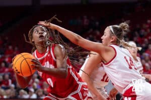 Nebraska Cornhusker guard Callin Hake (14) defends against Bradley Brave guard Kaylen Nelson (0) taking a shot in the first half during a college basketball game on Wednesday, Dec. 3, 2025, in Lincoln, Nebraska. Photo by John S. Peterson.