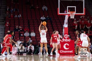 Nebraska Cornhusker guard Callin Hake (14) makes a three point shot against the Bradley Braves in the first half during a college basketball game on Wednesday, Dec. 3, 2025, in Lincoln, Nebraska. Photo by John S. Peterson.