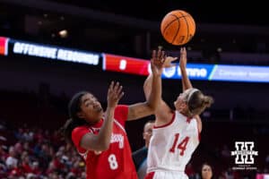 Nebraska Cornhusker guard Callin Hake (14) does after the ball against Bradley Brave guard Micah Cooper (8) in the first half during a college basketball game on Wednesday, Dec. 3, 2025, in Lincoln, Nebraska. Photo by John S. Peterson.