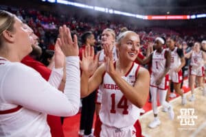 Nebraska Cornhusker guard Callin Hake (14) gives Logan Nissley high fives before taking on the Bradley Braves during a college basketball game on Wednesday, Dec. 3, 2025, in Lincoln, Nebraska. Photo by John S. Peterson.