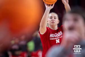 Nebraska Cornhusker forward Emily Fisher (34) takes a shot warming up for the Bradley Braves during a college basketball game on Wednesday, Dec. 3, 2025, in Lincoln, Nebraska. Photo by John S. Peterson.