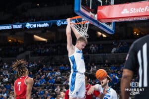 Creighton Bluejay Josh Dix (4) throws down a put back dunk during a college basketball game against Nicholls on Tuesday, Dec 2, 2025, in Omaha, Nebraska. Photo by Brandon Tiedemann.