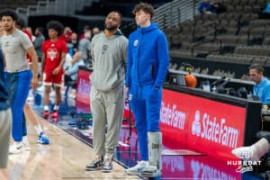 Creighton Bluejay Hudson Greer (10) stands on the sideline in a boot before a college basketball game against Nicholls on Tuesday, Dec 2, 2025, in Omaha, Nebraska. Photo by Brandon Tiedemann.