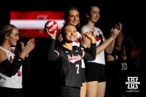Nebraska Cornhusker libero/defensive specialist Maisie Boesiger (7) starts as the libero and throws out a mini-volleyball during introductions before a volleyball match against the Ohio State Buckeyes on Saturday, Nov. 29, 2025, in Lincoln, Nebraska. Photo by John S. Peterson.