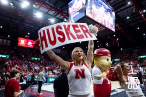 Nebraska Cornhuskers cheerleader doing "Husker Power" before the volleyball match against the Ohio State Buckeyes on Saturday, Nov. 29, 2025, in Lincoln, Nebraska. Photo by John S. Peterson.