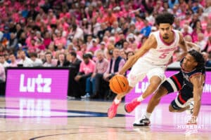 Creighton Bluejay Nik Graves (5) drives past Silas Demary Jr. (2) during a college basketball game against UCONN on Jan 31, 2026, in Omaha, Nebraska. Photo by Brandon Tiedemann