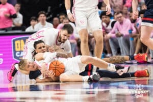 Creighton Bluejay Ty Davis (9) dives for a loose ball during a college basketball game against UCONN on Jan 31, 2026, in Omaha, Nebraska. Photo by Brandon Tiedemann