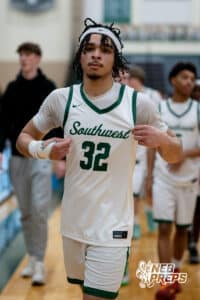 Lincoln Southwest Silverhawk Kobi Kerr (32) point to his uniform against Lincoln Southeast during a high school basketball game, Thursday, Jan. 29, 2026, Lincoln, Nebraska. Photo by Braden Cochran.