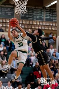 Lincoln Southwest basketball player Dakari Wilson (30) fights for a layup against Lincoln Southeast Rowan Lambert (0) during a high school basketball game, Thursday, Jan. 29, 2026, Lincoln, Nebraska. Photo by Braden Cochran.